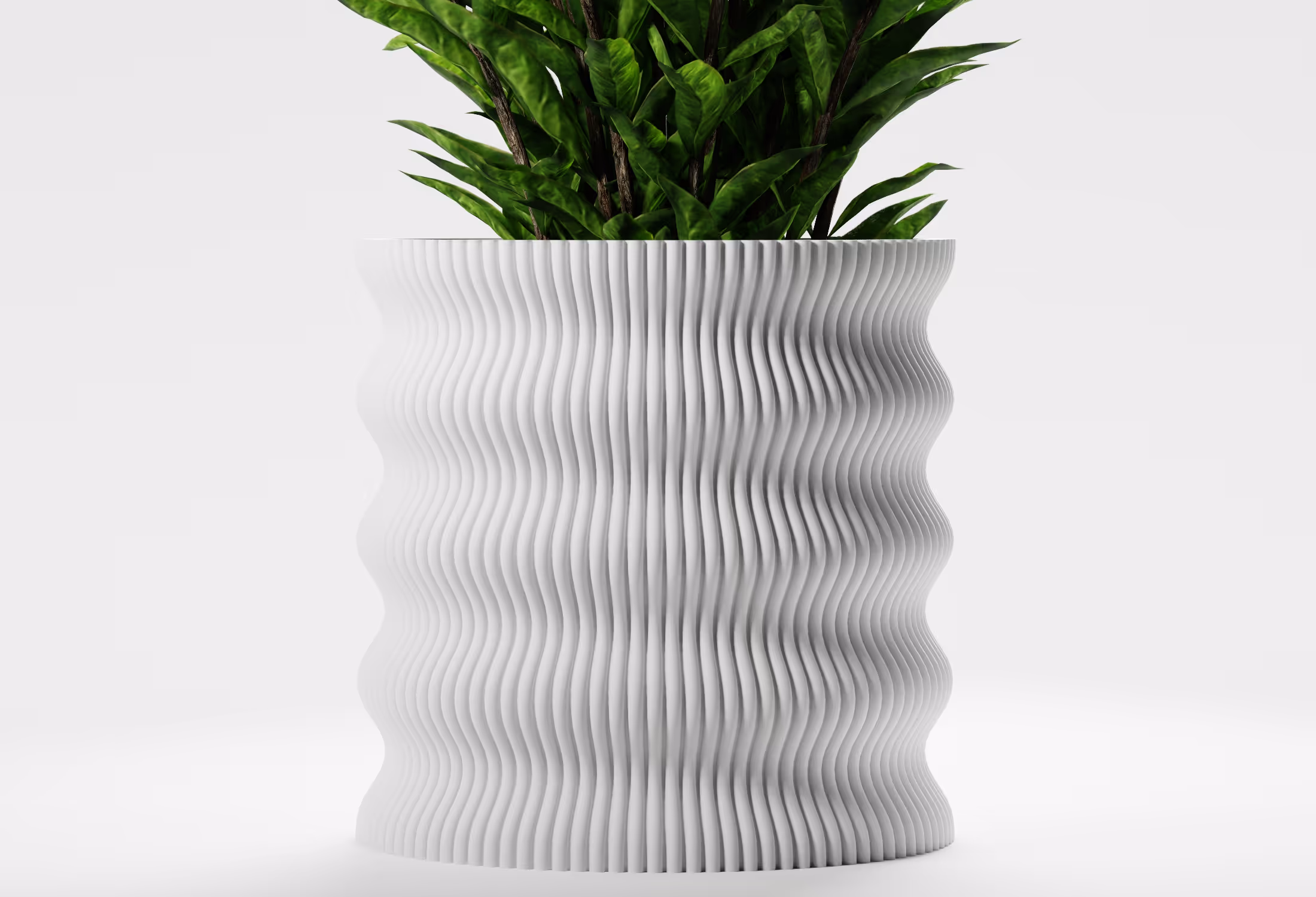 White wavy textured planter with green leafy plants on a plain white background.