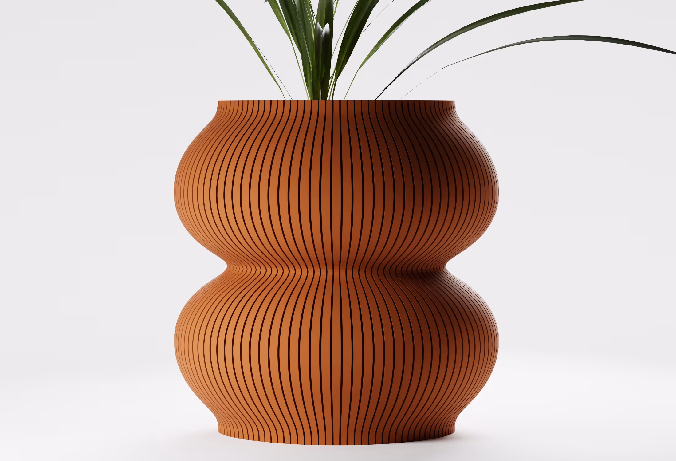Curved terracotta vase with vertical black stripes holding green plant leaves.