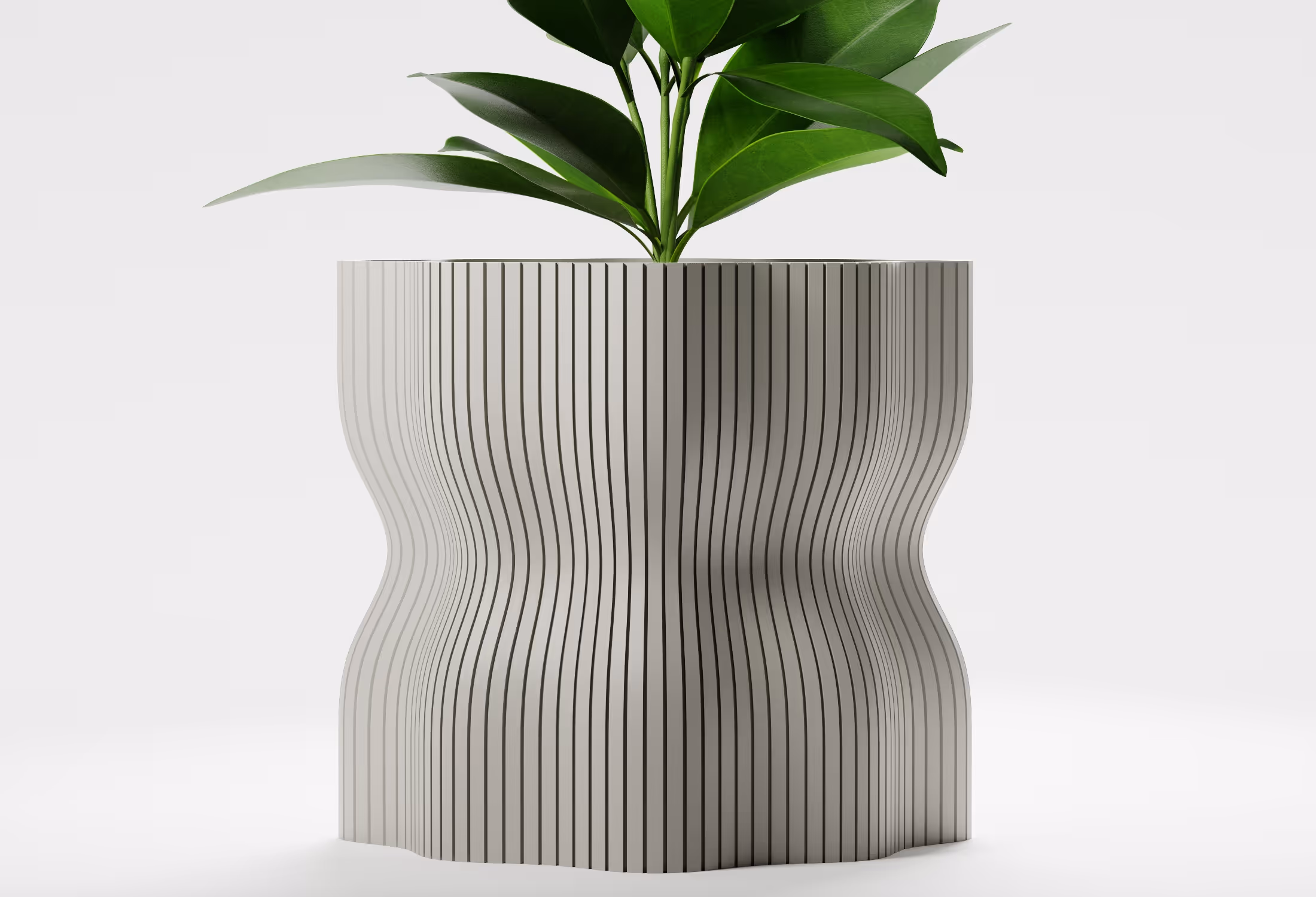 Modern gray planter with vertical black stripes holding a green leafy plant on a white background.